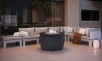 Ledge Lounger Halo Firepit lifestyle, sectional sofa nighttime patio ambiance