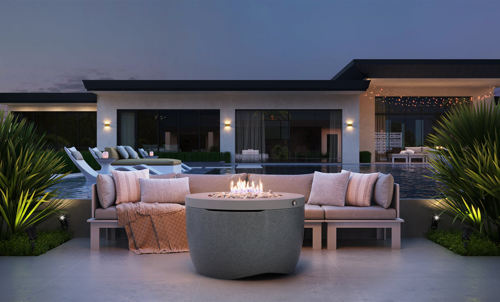 Ledge Lounger Halo Firepit lifestyle, twilight poolside patio setting