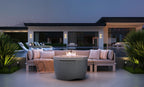 Ledge Lounger Halo Firepit lifestyle, twilight poolside patio setting