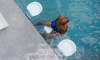 White Signature Bar Height in-pool barstools at a swim-up counter