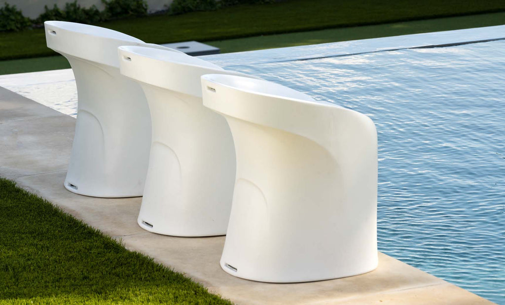Ledge Lounger Signature counter-height in-pool barstools beside a residential pool