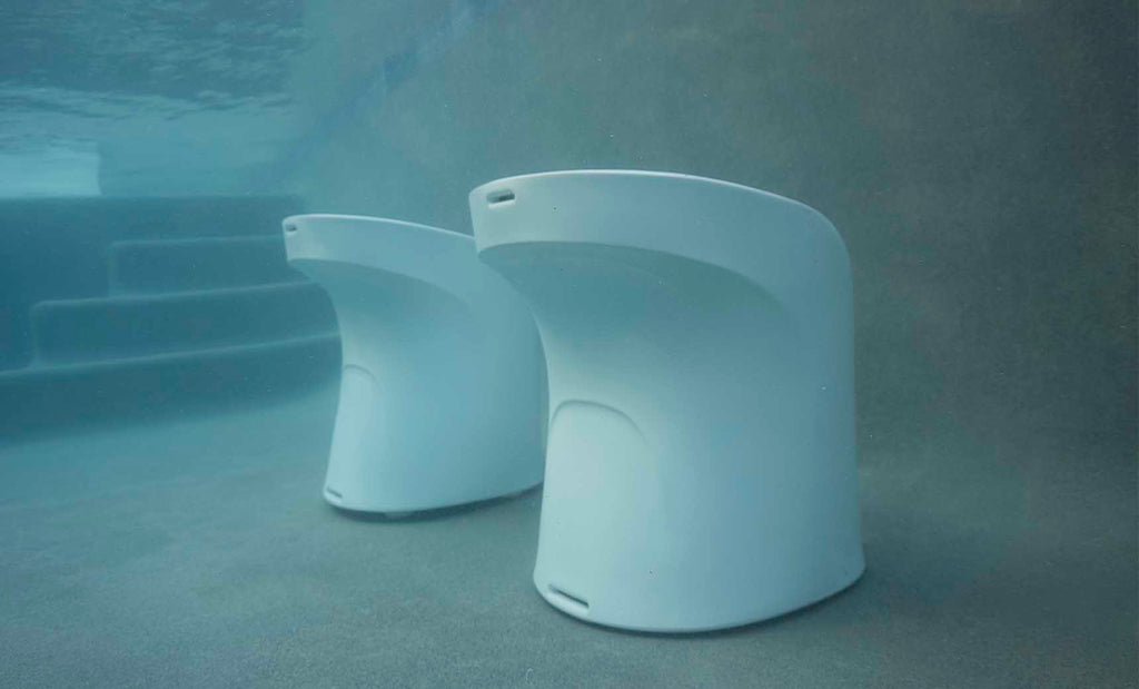 White Signature counter-height barstools arranged in a residential pool