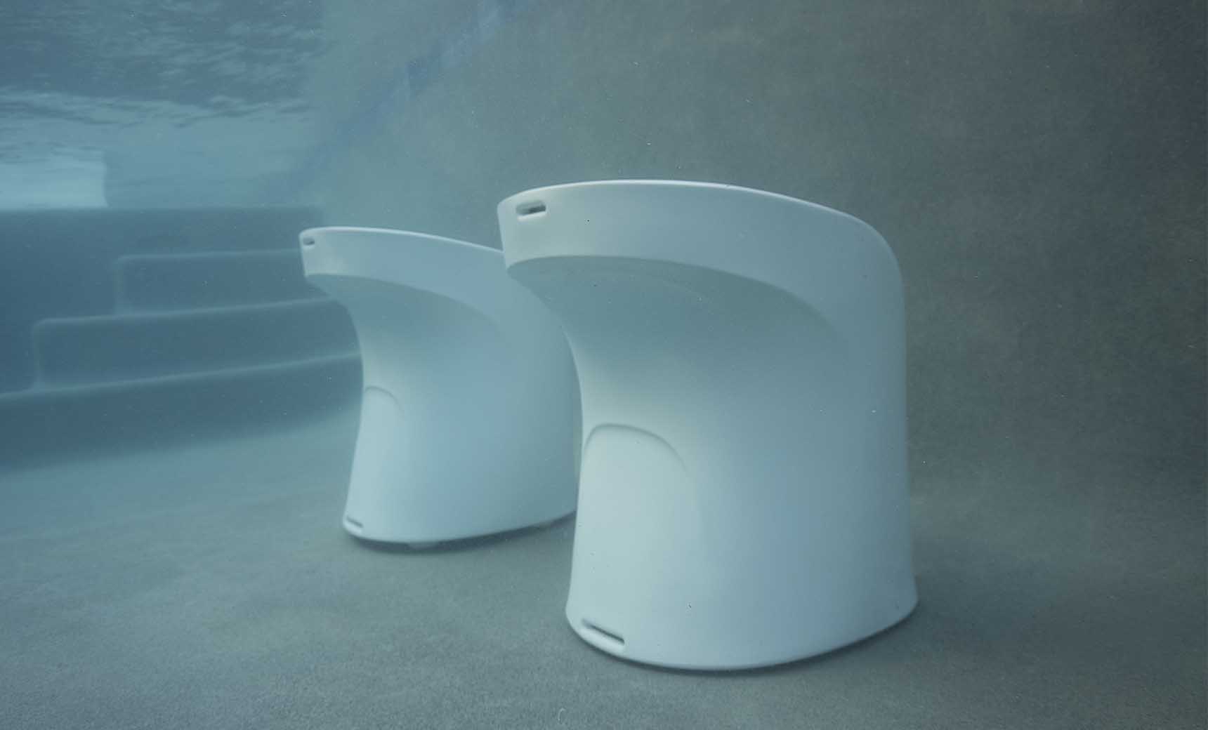 White Signature counter-height barstools arranged in a residential pool