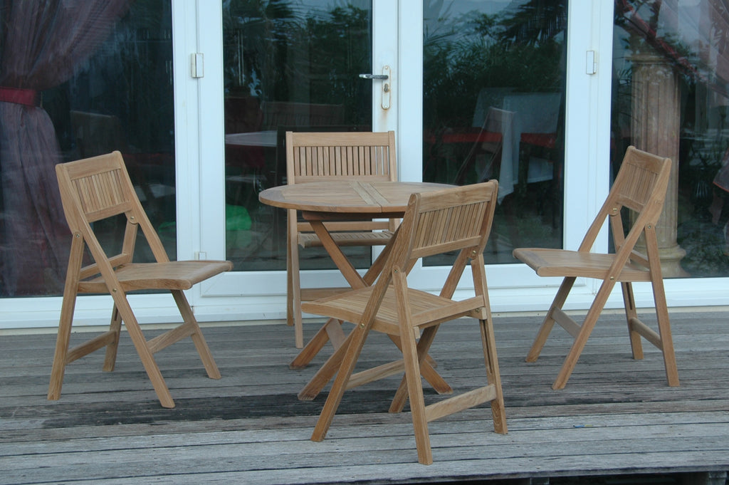 Windsor 5-Piece Bistro Set on a patio near glass doors