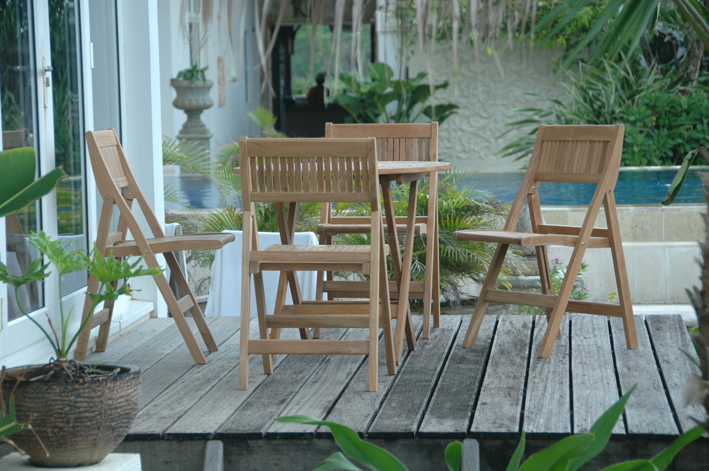 Windsor 5-Piece Bistro Set styled on a poolside deck