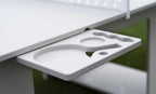 Pull-out accessory tray beneath the all-weather table tennis set with molded storage for paddles, balls and drinks