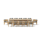 Front view of the Coronado teak dining set for twelve with gray seat and back cushions.
