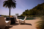 Ledge Lounger Autograph Chair lifestyle, White, poolside fire pit entertaining setup