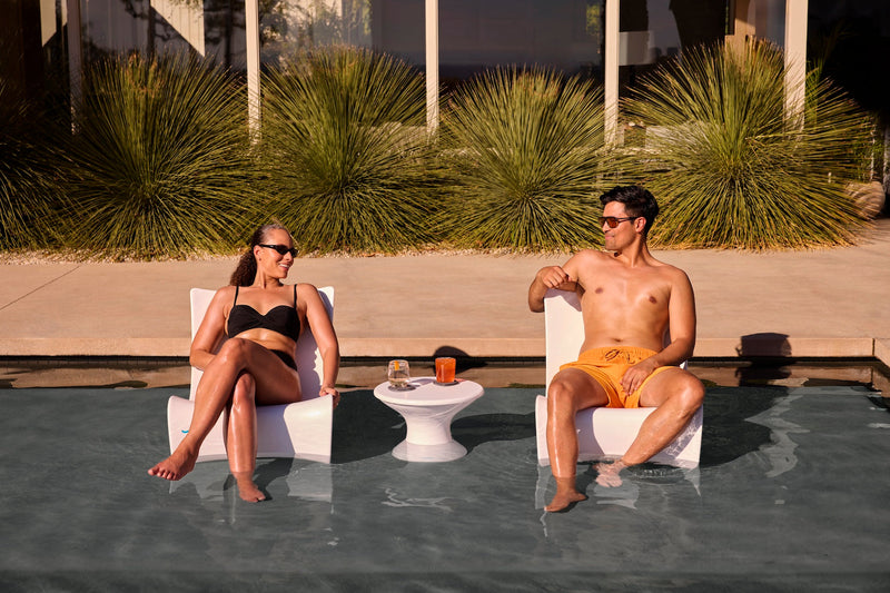 Ledge Lounger Autograph Chair lifestyle, White, couple relaxing in shallow pool