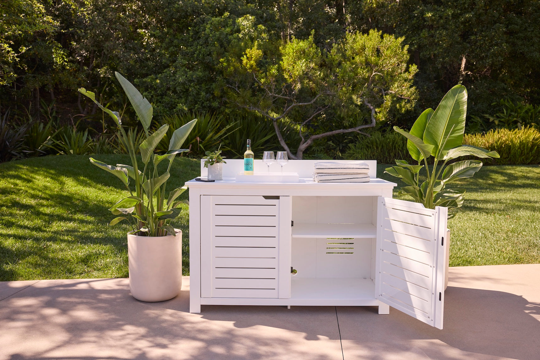 Ledge Lounger Mainstay Bar Credenza lifestyle, White, patio entertaining with wine and glasses