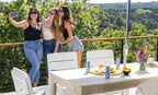 Ledge Lounger Mainstay Rectangular Dining Table lifestyle, White, guests gathered poolside