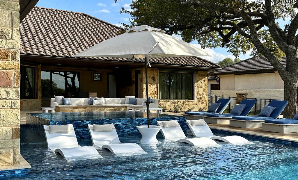 White Ledge Lounger Essential umbrella shading an in-pool lounge setting; select canopy size separately.