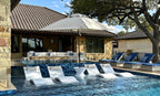 White Ledge Lounger Essential umbrella shading an in-pool lounge setting; select canopy size separately.