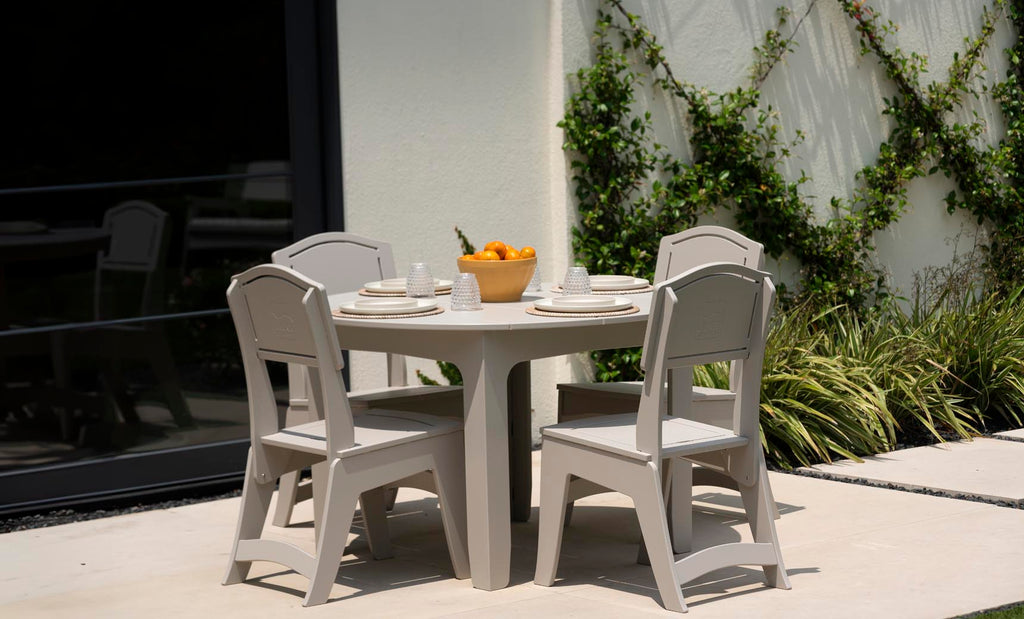 Ledge Lounger Mainstay Round Dining Table lifestyle, patio dining with chairs and place settings