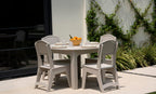 Ledge Lounger Mainstay Round Dining Table lifestyle, patio dining with chairs and place settings
