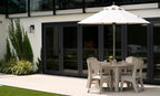 Ledge Lounger Mainstay Round Dining Table lifestyle, under umbrella poolside patio