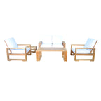 Teak loveseat and two armchairs with light cushions arranged around a square outdoor coffee table.