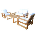 Side view of a teak outdoor loveseat set with two cushioned armchairs and a coffee table.