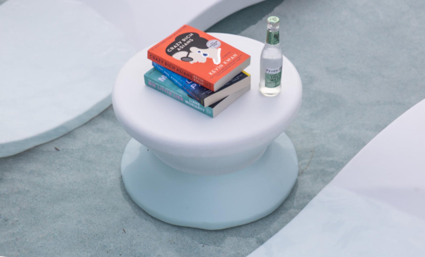 Ledge Lounger Signature Standard Side Table in White on a shallow sun shelf between Signature chaises