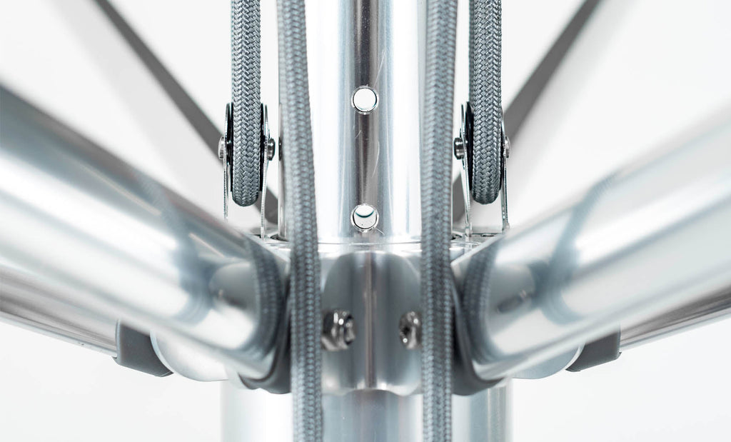 Close-up of the Premier Umbrella pulley ropes, aluminum hub and support ribs