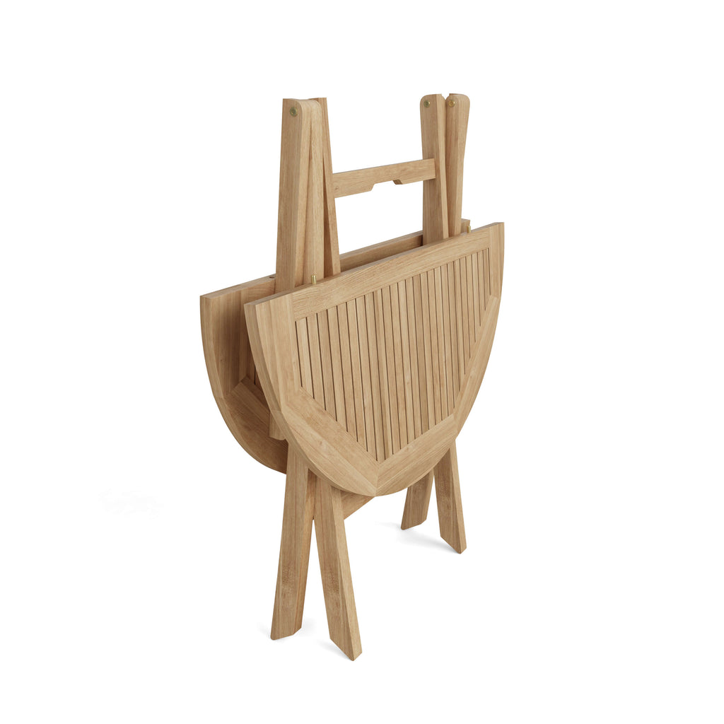 Windsor round folding teak table shown folded flat for storage