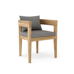 Coronado teak dining armchair with gray seat and back cushions.