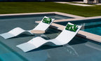 Ledge Lounger Autograph Chaise pair, White, in-pool with side table setup