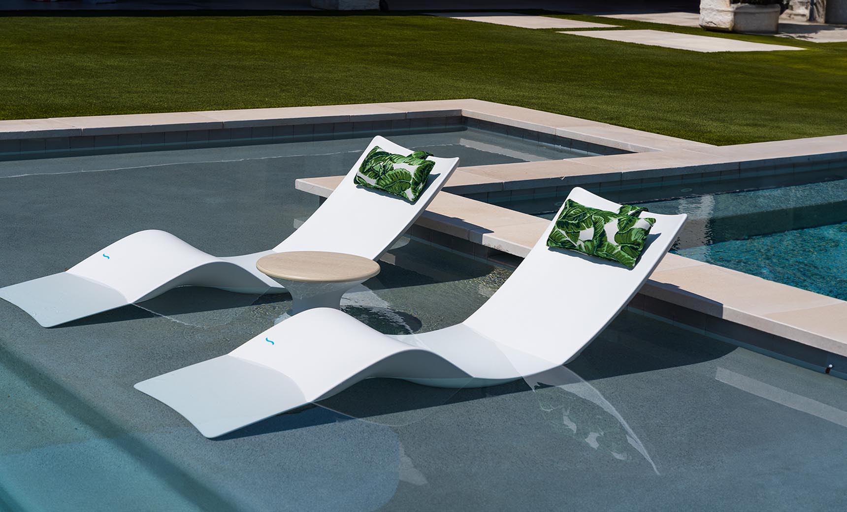 Ledge Lounger Autograph Chaise pair, White, in-pool with side table setup