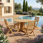 Andrew Butterfly round folding teak table and four chairs on a pool terrace