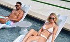 Autograph Standard Side Table between two chaises on a shallow pool ledge; seating sold separately