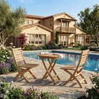 Bahama Andrew round folding teak table and two chairs on a garden pool patio