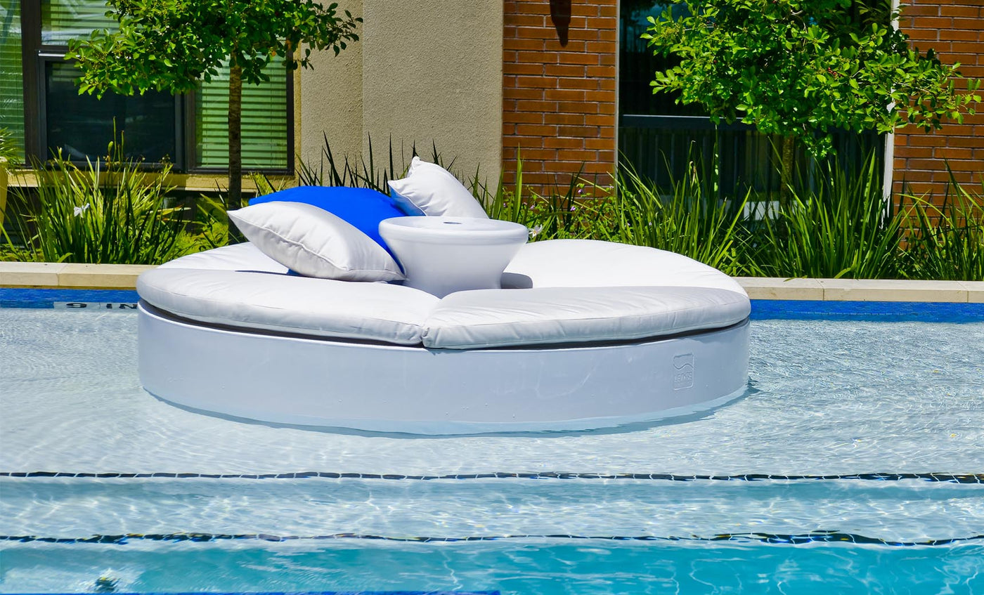 Signature Round Sunbed installed on a shallow pool ledge
