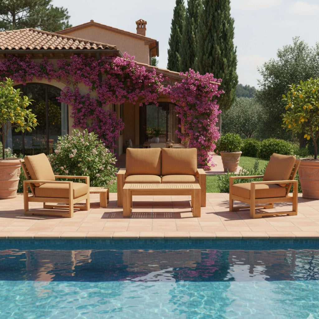 Capistrano teak loveseat, two armchairs, coffee table and side table beside a swimming pool; lifestyle setting