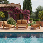 Capistrano teak loveseat, two armchairs, coffee table and side table beside a swimming pool; lifestyle setting