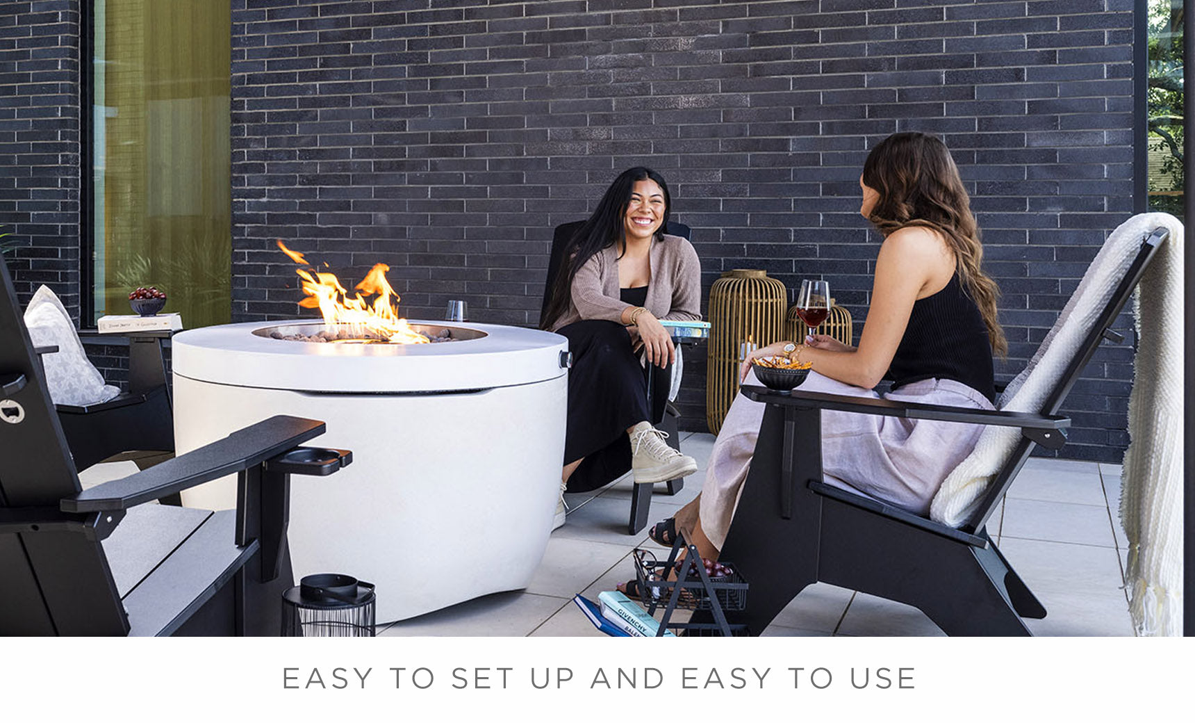 Ledge Lounger Halo Firepit lifestyle, guests relaxing with wine poolside