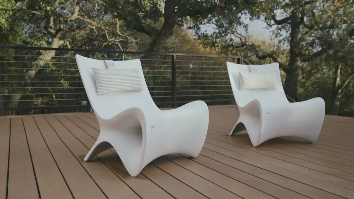 White Ledge Lounger Autograph Chairs on a deck and sun shelf. Pillows and tables are separate.