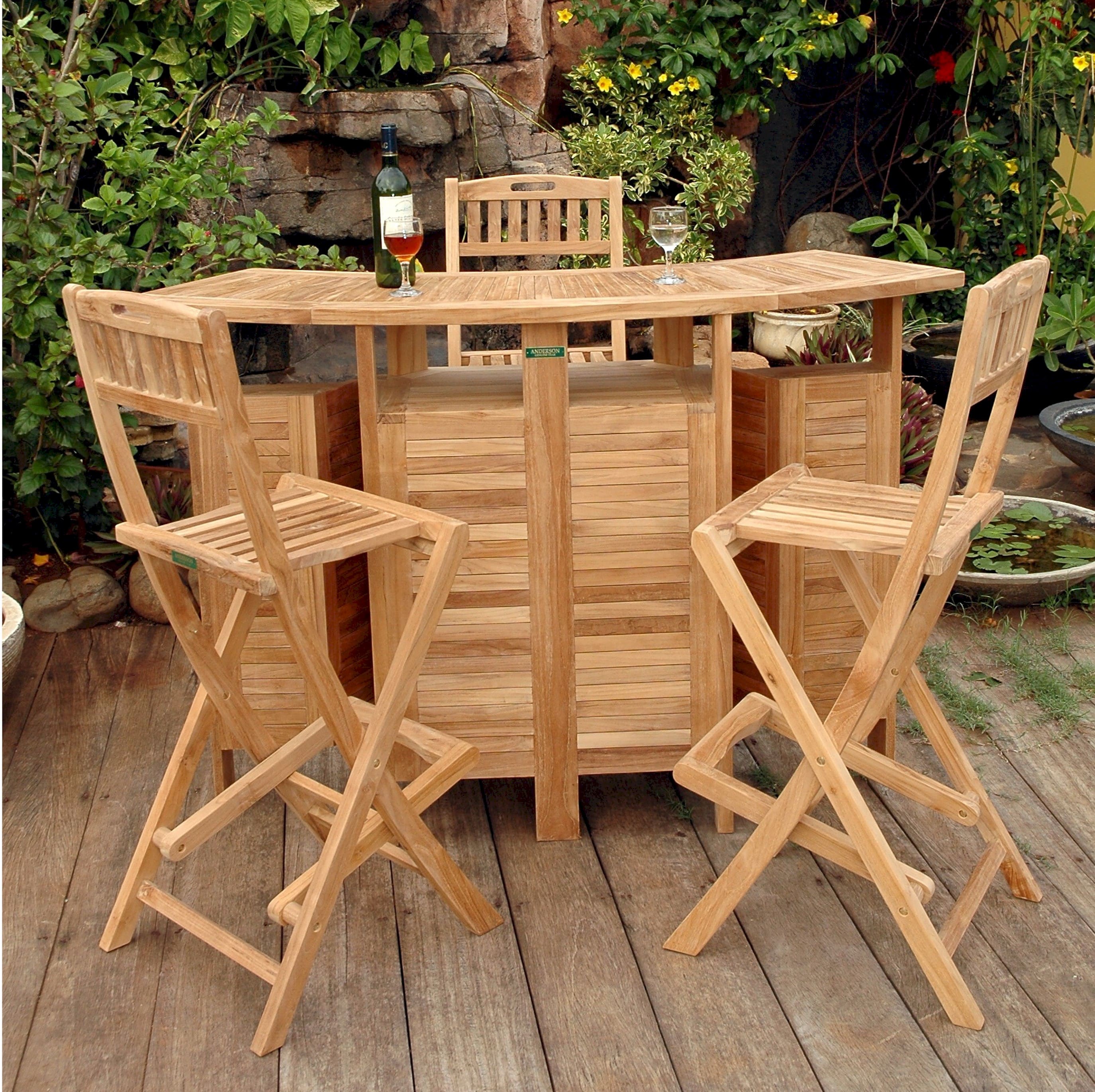 Altavista folding teak bar and chairs in a tropical garden setting