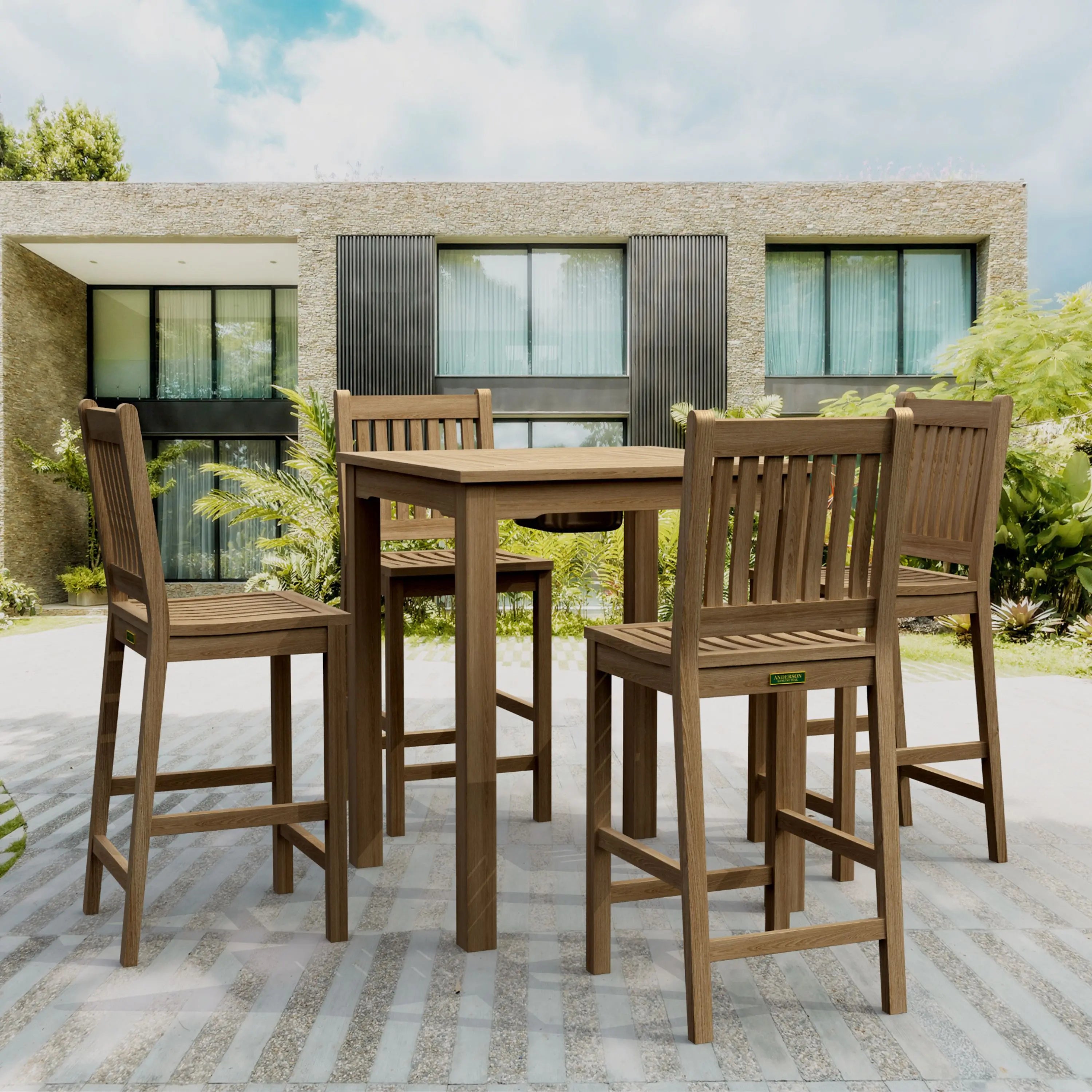 Chatsworth Avalon teak bar set arranged on a patio outside a modern residence