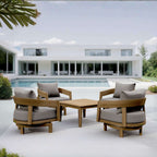 Set 371 Toscana teak swivel conversation set with gray cushions on a modern pool patio