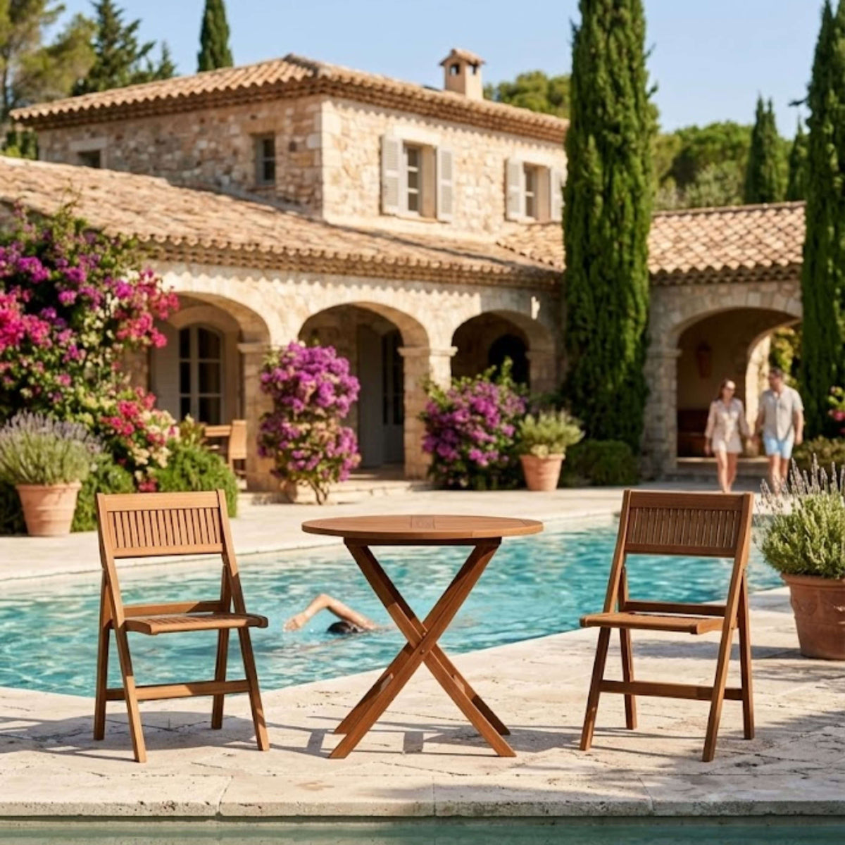 Windsor round folding teak bistro set for two beside a villa pool