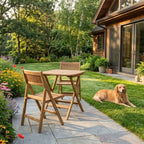 Windsor square teak bistro table and two chairs beside a lawn and timber home