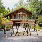 Windsor square folding teak bistro set outside a modern timber home